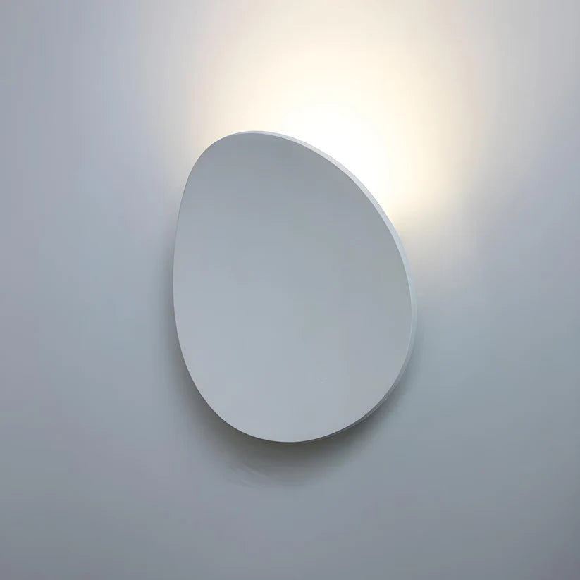 Modern Minimalist Wall Lamp with Organic Disc Shape and Warm LED Glow