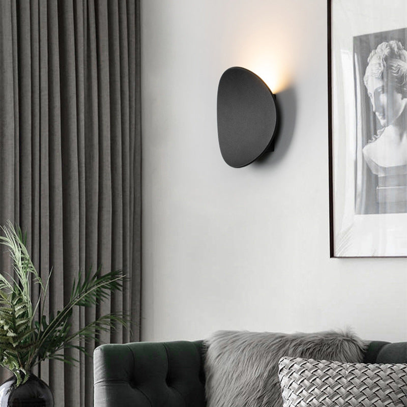 Modern Minimalist Wall Lamp with Organic Disc Shape and Warm LED Glow