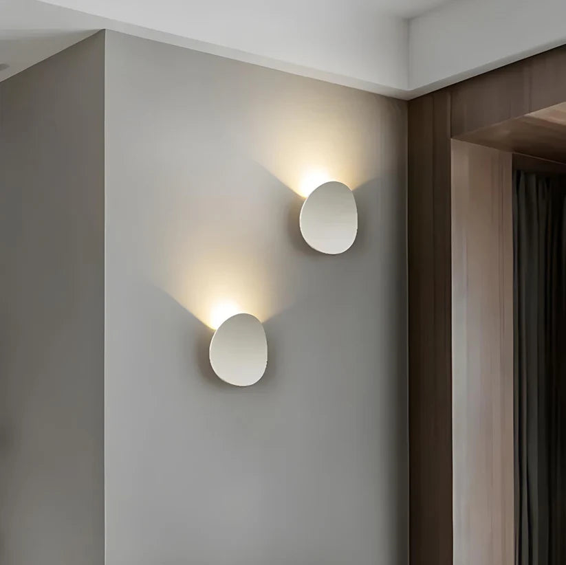 Modern Minimalist Wall Lamp with Organic Disc Shape and Warm LED Glow