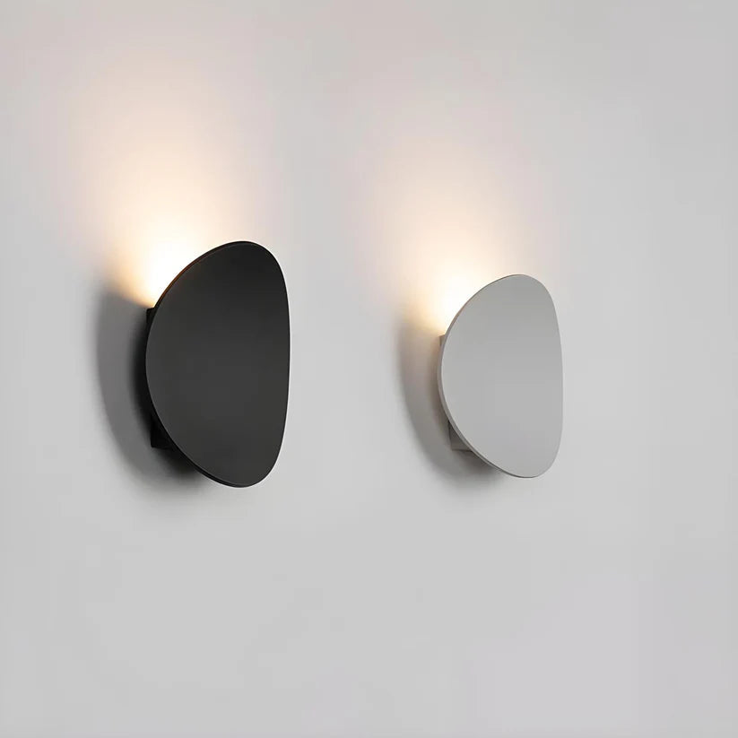 Modern Minimalist Wall Lamp with Organic Disc Shape and Warm LED Glow