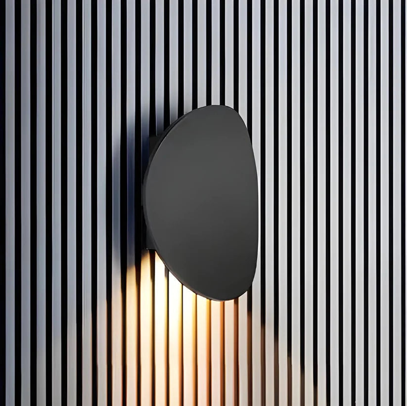 Modern Minimalist Wall Lamp with Organic Disc Shape and Warm LED Glow