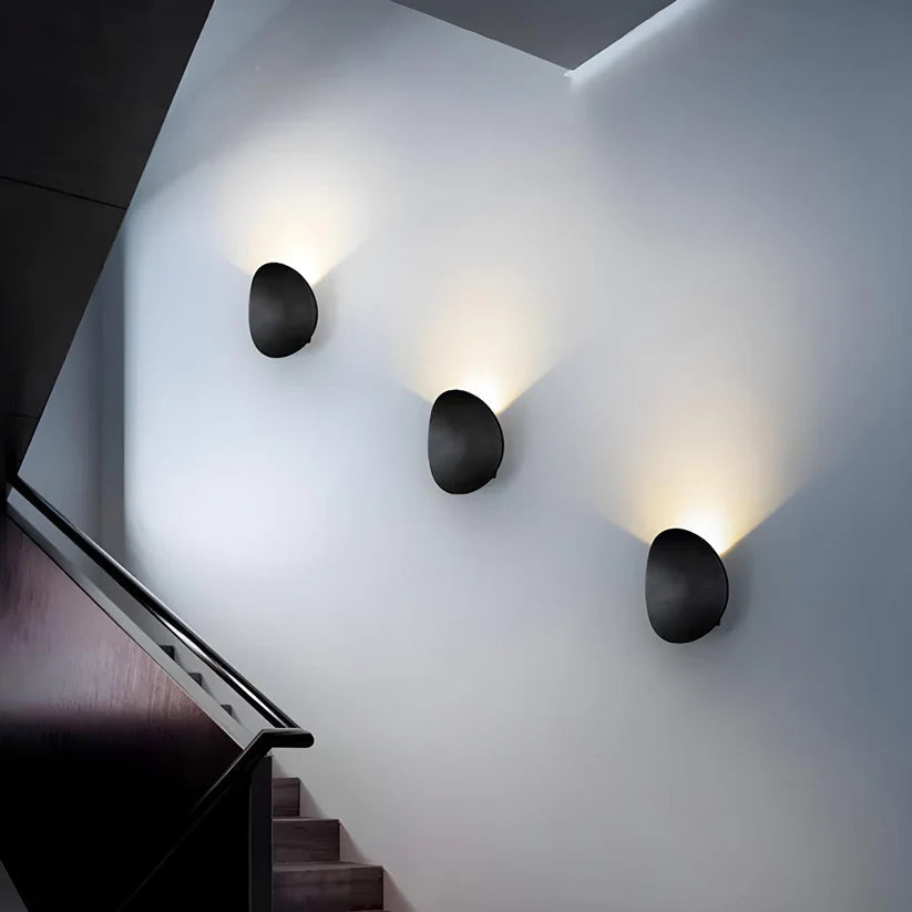 Modern Minimalist Wall Lamp with Organic Disc Shape and Warm LED Glow