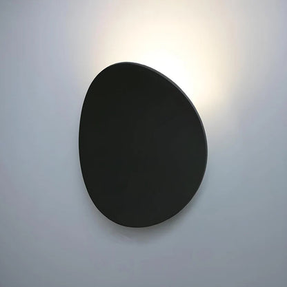 Modern Minimalist Wall Lamp with Organic Disc Shape and Warm LED Glow
